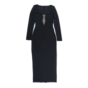 Detail of sequined V-neck with mesh insert on elegant black bodycon fishtail dress
