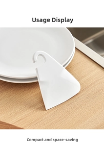 Grattoir en silicone blanc avec trou de suspension pour nettoyer les résidus alimentaires