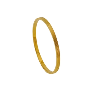 Close-up of a minimalist gold-plated titanium steel bangle with vertical groove textures