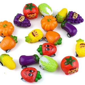 Miniature fruit and vegetable pull-back toy cars with cute cartoon faces on white background