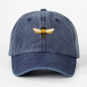 Washed navy blue denim baseball cap featuring a yellow and black honey bee embroidery