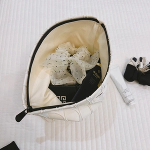 Chic black and white geometric jacquard makeup bag with spacious interior storage