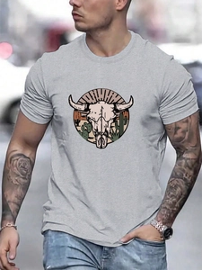 Detail of grey men's T-shirt featuring a vintage bull skull and desert print outdoors