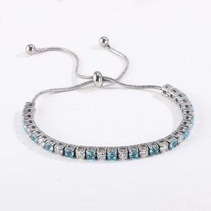 Detail of adjustable tennis bracelet with round blue and white cubic zirconia stones