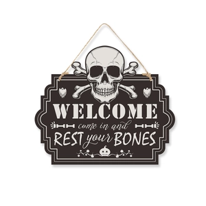 Detail of wooden Halloween welcome sign featuring skull crossbones and festive lettering