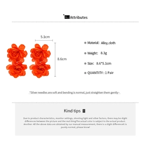 Detail view of orange fabric double-layer flower earrings with measurements and specs