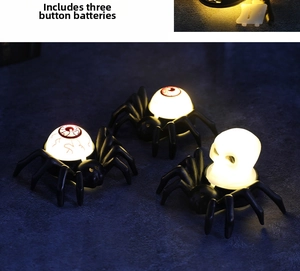 Halloween spider LED candles with skull and eyeball designs showing internal glow feature