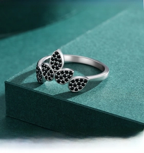 Close-up of S925 sterling silver ring with crown-shaped black zircon pave setting