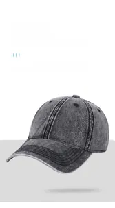 Close-up of vintage washed denim baseball cap featuring neat stitching and fabric texture