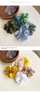 Silky satin scrunchies in various Morandi colors with elegant pleated texture detail