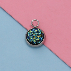 Detailed macro view of 12mm stainless steel pendant base with blue-green glitter stone