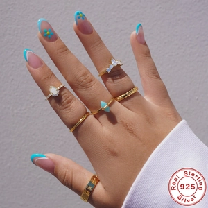 925 sterling silver gold rings set featuring twisted bands and opal gemstones on hand