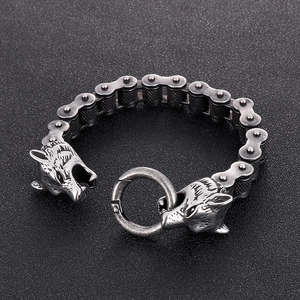 Macro detail of punk wolf head bicycle chain bracelet in vintage oxidized steel