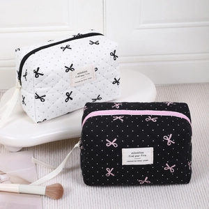 Stylish quilted bow pattern makeup bags in black and white with zipper and top handle