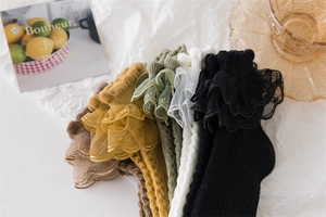 Assorted colors of ruffled lace cotton socks featuring cable knit patterns and textures