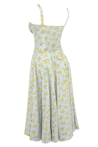 Detail of light blue floral dress showing slim fit cut and back zipper closure