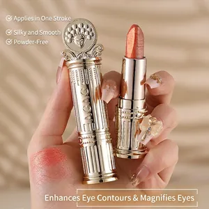 Golden two-tone shimmer eyeshadow stick with embossed design for effortless eye makeup