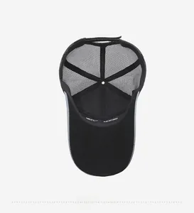 Detail view of the breathable mesh trucker hat interior featuring sweatband and adjustable strap