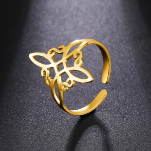 Macro detail of golden adjustable ring with hollow butterfly and floral design pattern