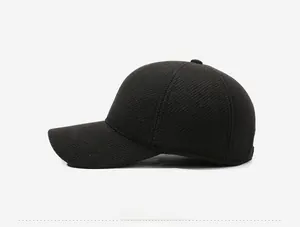 Detail of dark grey herringbone fabric baseball cap with silver Jeans metal side logo