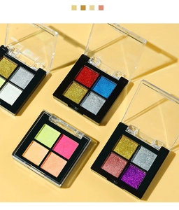 Macro shot of 4-color solid aurora nail powder palette with metallic mirror effect