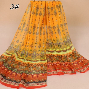 Detail of bohemian chiffon scarf with ethnic floral prints and warm orange tones