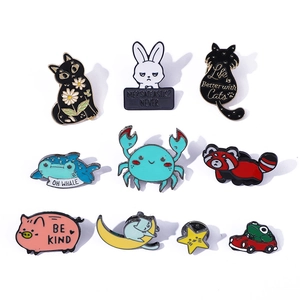 Detailed set of ten colorful enamel animal pins featuring cats, crabs and cute slogans