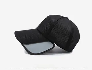 Detail view of the black mesh baseball cap with gray retractable sunshade brim extension