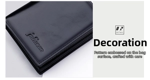 Detail of black vertical leather wallet showing fine texture and embossed brand logo