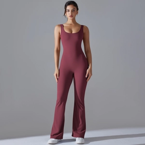 Detail of slim fit backless yoga jumpsuit with flared pants in deep burgundy wine red
