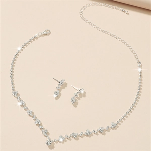 Elegant silver bridal jewelry set with sparkling rhinestone necklace and drop earrings