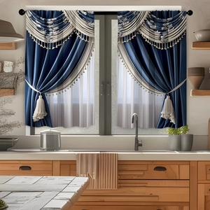 Close-up of blue kitchen curtain with white pattern, elegant tassels and fabric tiebacks
