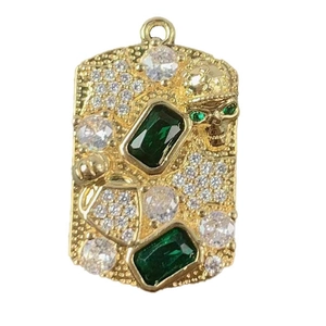 Gold military dog tag pendant with emerald skull and sparkling white zircon stones