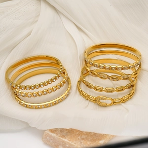 Elegant 18K gold-plated stainless steel bangles with sparkling zircon and star motifs