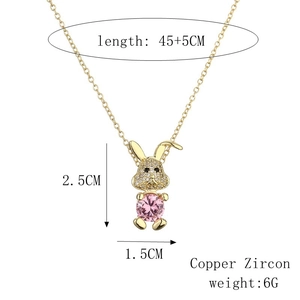 Detail of gold rabbit pendant with pink zircon, listing dimensions 2.5x1.5CM and chain length