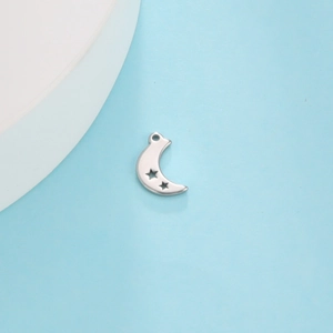 Detailed close-up of a silver stainless steel crescent moon pendant with star cutouts