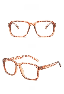 Vue avant et latérale de montures de lunettes carrées surdimensionnées en acétate écaillé