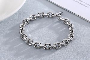 Detailed view of silver stainless steel chain bracelet with OT toggle clasp and glossy finish