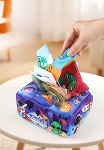 Close-up of baby sensory tissue box toy with space theme and soft fabric squares