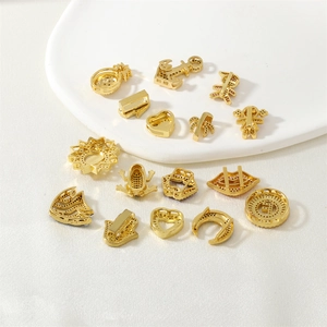 Collection of gold-tone micro-paved zircon pendants in heart, palm, and animal shapes