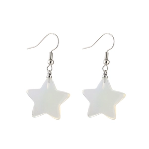 Detailed macro shot of white star-shaped earrings with vintage turquoise style hooks
