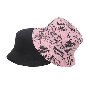 Reversible bucket hat with black solid side and pink anime graphic print for couples