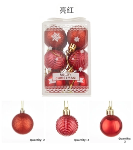 Detailed view of red Christmas ball set with matte, textured and glossy finishes in 6cm size