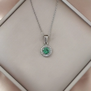 Luxurious stainless steel necklace with green zircon round pendant on silk