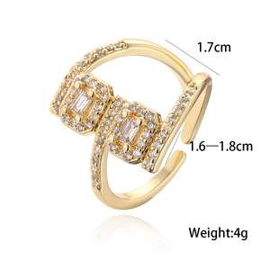 Gold-plated geometric open ring with rectangular zircon and pave crystals on white background