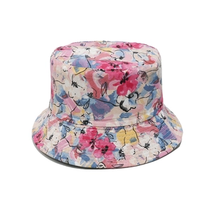 Detail of floral print sun hat with pink and blue blossoms and precise edge stitching