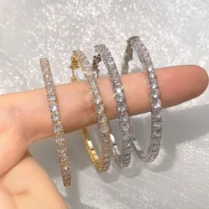 Chic gold and silver oversized hoop earrings with full pavé cubic zirconia inlay