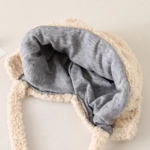Plush baby bear hat featuring a soft cream faux fur exterior and warm grey knit lining