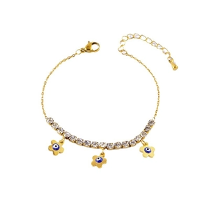 Golden flower bracelet with evil eye charms and white rhinestones on white background