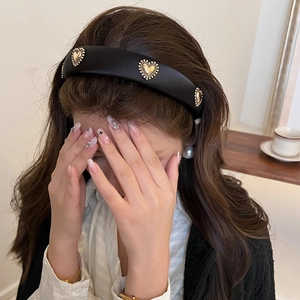 French retro black satin headband featuring three vintage gold heart ornaments for women